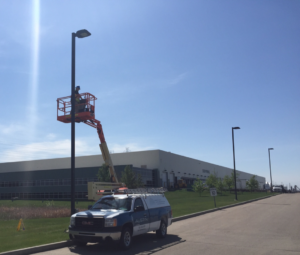 edmonton security camera installation  - in progress with large truck and boom
