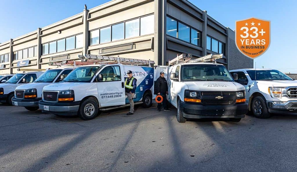 Security company vans outside office building.