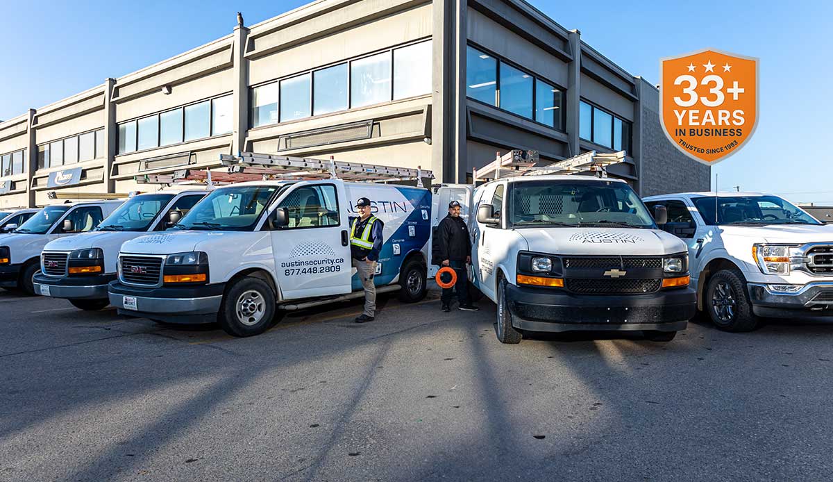 Security company vans outside office building.