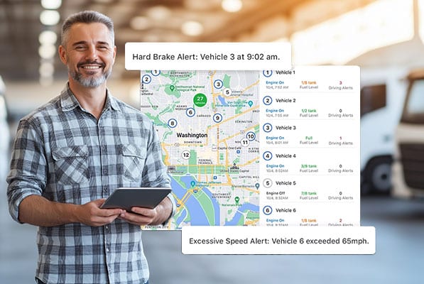 Man tracking vehicles with GPS alerts on tablet.